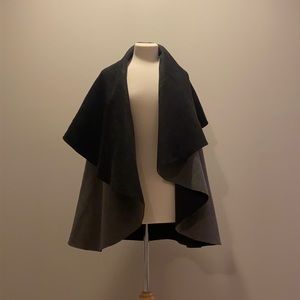 Black and gray reversible poncho. One size.